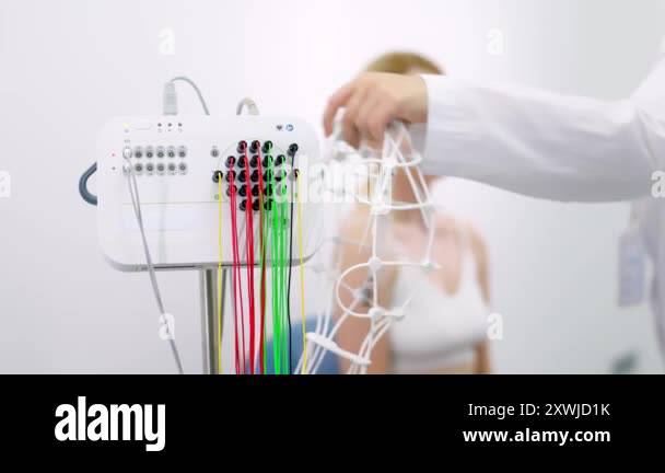 Patient is preparing for a brain activity scan. Ideal for illustrating ...
