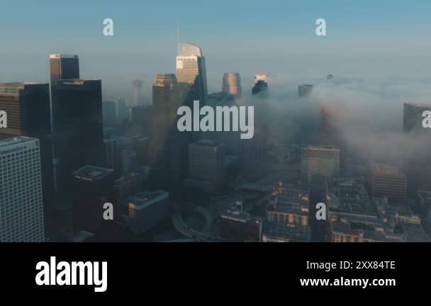 This aerial photograph shows Downtown Los Angeles in morning fog ...