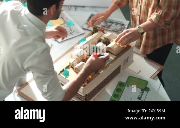 Smart architect or civil engineer writing building structure idea on ...