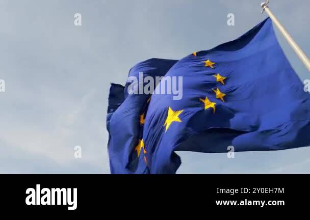 A close-up shot of the European Union flag waving in the wind, with its ...