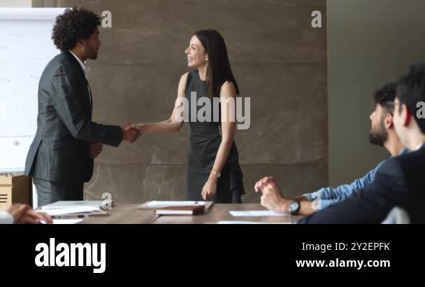 Getting Applause Successful young Arab business leader man shaking hands with best ...