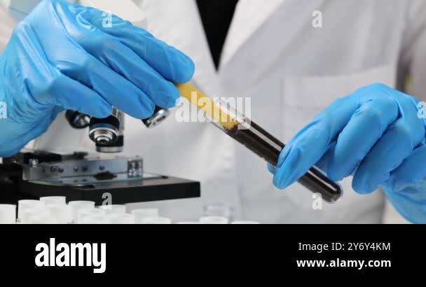 Soil laboratory analysis scientist measures pH of soil sample with ...