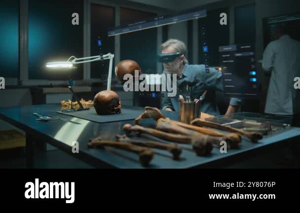 Advanced archaeological lab: Archaeologist in VR headset examines ...