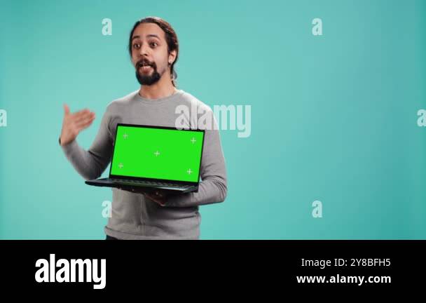 Tech content creator doing influencer marketing using green screen ...