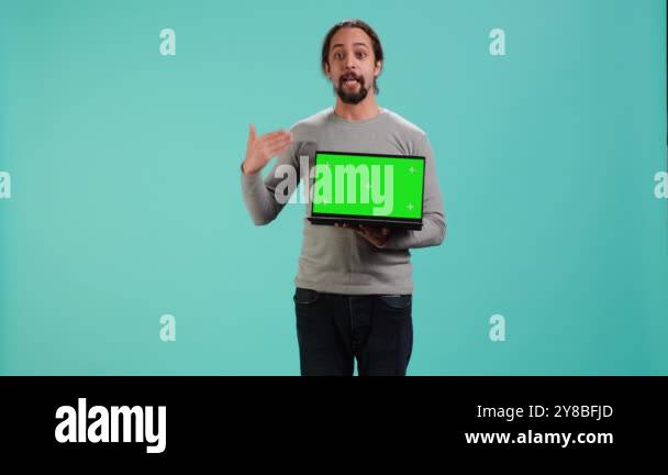 Tech content creator doing influencer marketing using green screen ...