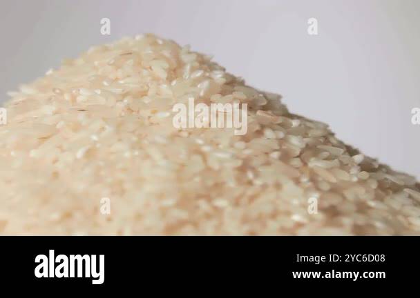 Local Rice Heap Dry Uncooked White Rice Heap on White Plate Rotating against White ...