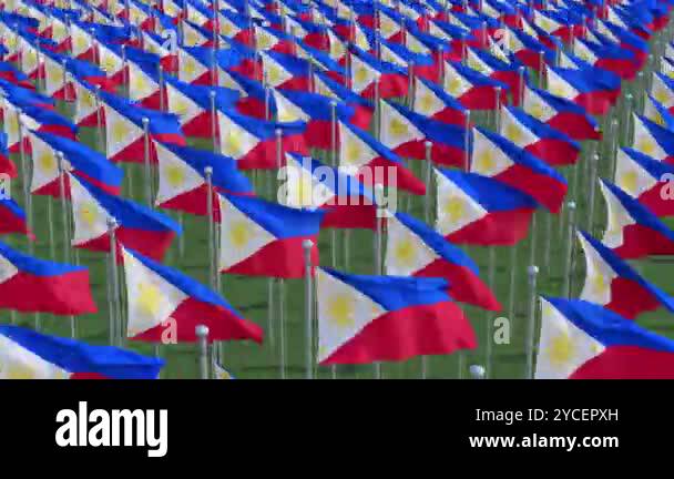 Philippine national flags waving in the wind against a blue sky ...