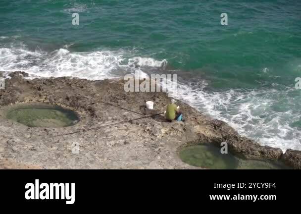 Fishing sea rocks Stock Videos & Footage - HD and 4K Video Clips - Alamy