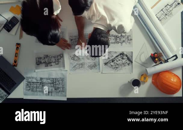Engineering Place Top down view of smart architect engineer place document at meeting ...