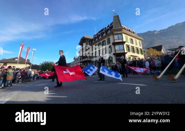 Through Ing Flags Watch as young Swiss performers in traditional attire display the art ...