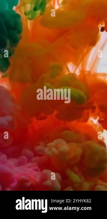 Dynamic ink clouds of primary colors flow underwater, producing a ...