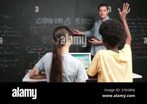 African boy raised hands to ask smart teacher about coding program ...