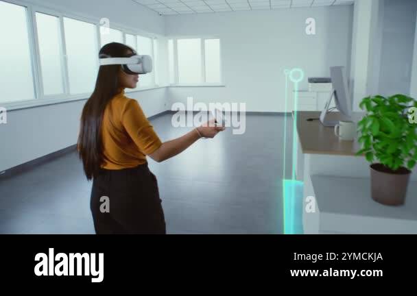 Creative Asian female designer wearing augmented reality headset uses ...