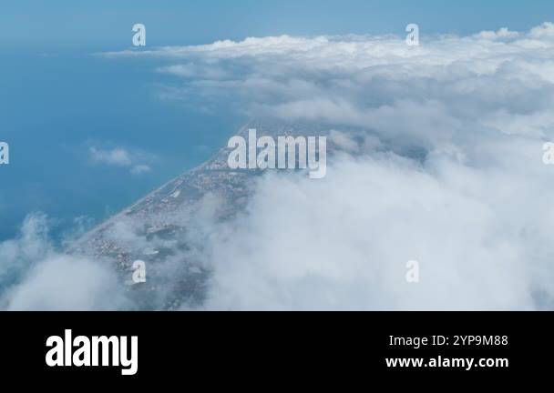 See a scenic mountain landscape with clouds, lush green forests, and ...