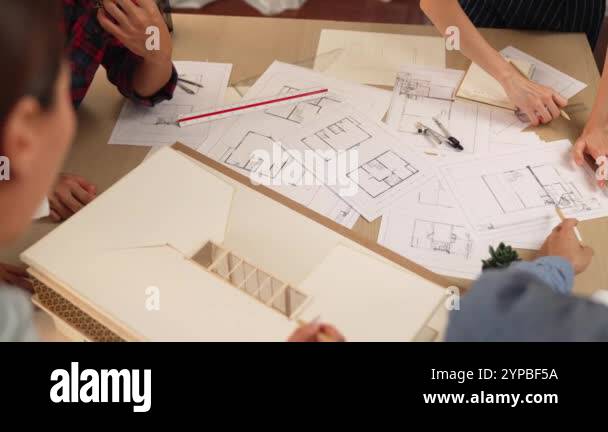 Slow motion interior designer drafting blueprint with customer ...