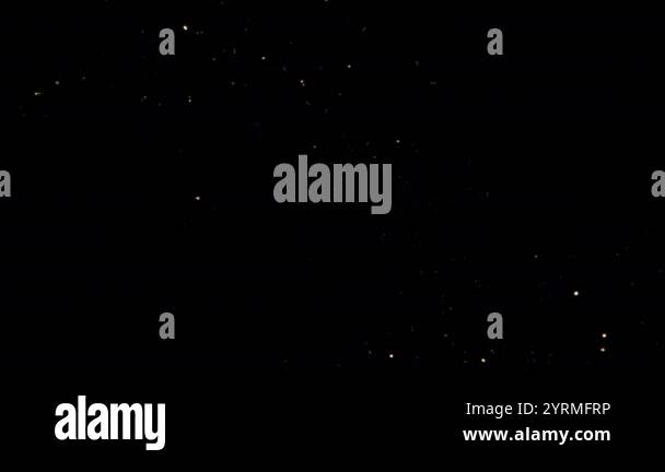 Loop glow sparking particles falling down animation on black abstract ...