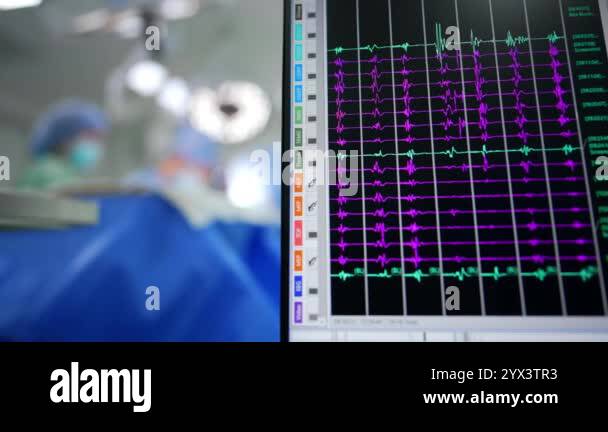 Green and violet curved lines on the black screen of computer. Close up ...