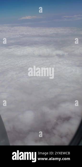 Expansive view of endless fluffy white clouds stretching across the ...