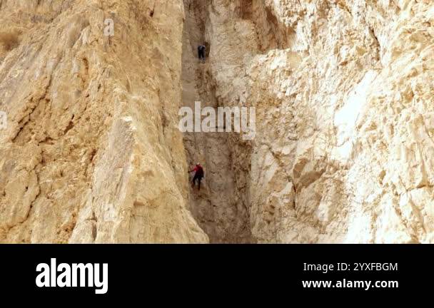 Arad, Israel, October 25, 2024 : Two experienced athletes descend on a ...