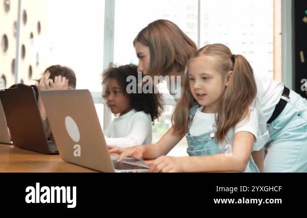 Multicultural smart student using laptop writing engineering code while ...