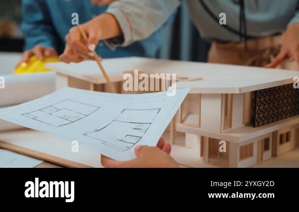 Slow motion interior designer drafting blueprint with customer ...