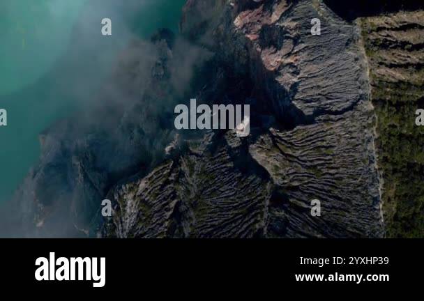 View of Sulfur Lake from the air. The drone flies over the Ijen volcano ...