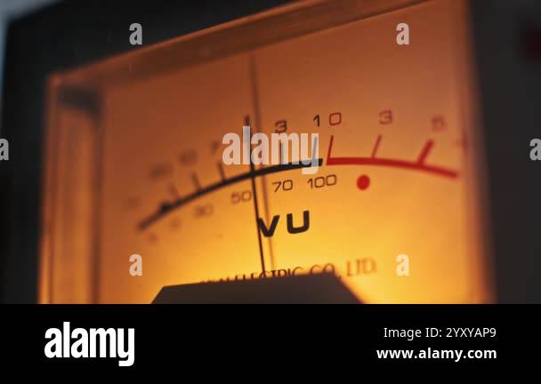 Needle Meter Exploding Close-up shot of a vintage VU meter needle fluctuating, glowing with ...