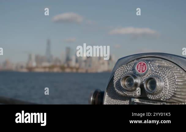 A coinoperated viewing machine offering a breathtaking skyline backdrop ...