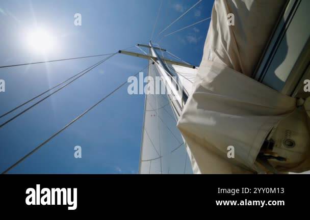 Sails Flapping Deck provides view of white sails flapping in gentle breeze. Sails ...