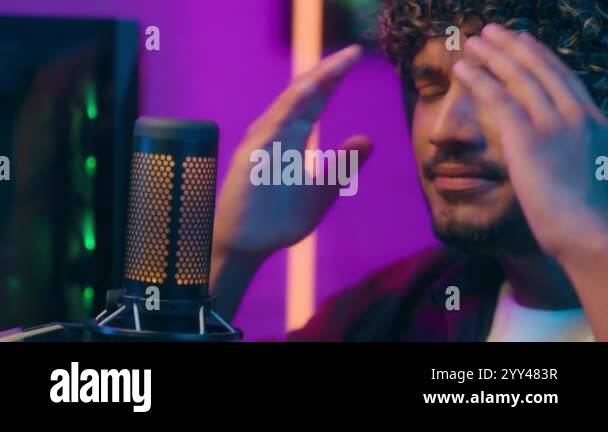 Angry Indian Latino Arabian man gaming play computer cyber microphone ...