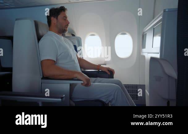 Scared Male Passenger Looking Out The Window Airplane. Man having a ...