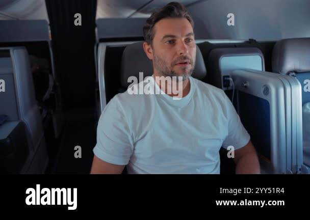 Scared Male Passenger Looking Out The Window Airplane. Man having a ...