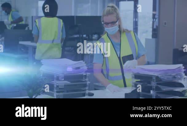 Cleaning office space, workers in safety vests and masks with blue ...
