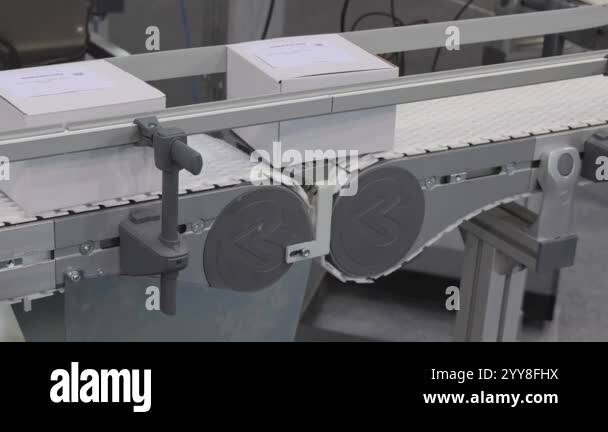 White Boxes At Plastic Conveyor Belt Transport System Factory Production Stock Video Footage Alamy