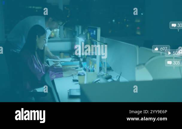Social media interaction icons animation over colleagues working late ...
