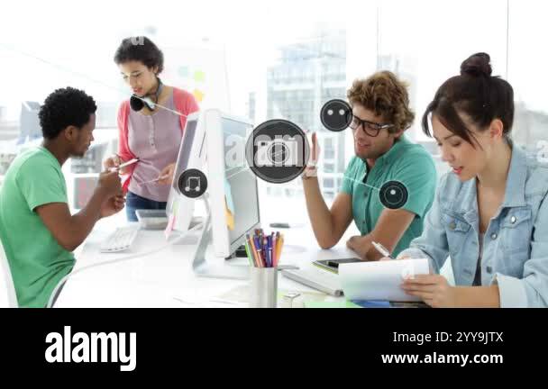 Media icons animation over diverse team collaborating in modern office ...