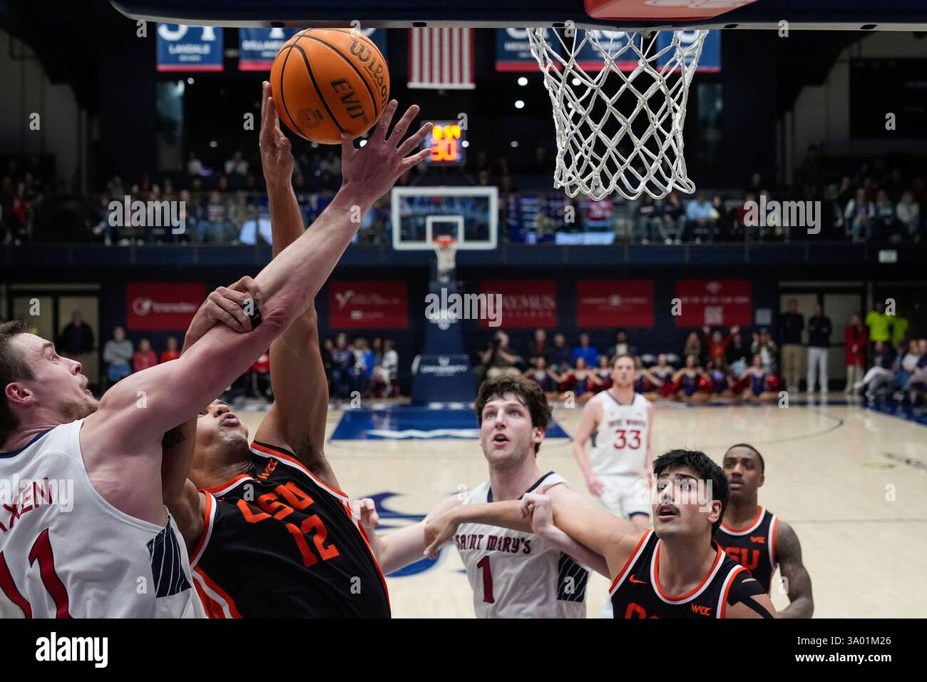 Bea Rataj Saint Mary's center Mitchell Saxen, left, and Oregon State forward ...