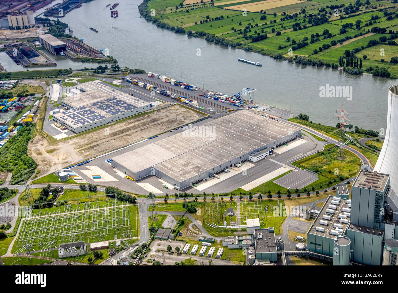Aerial view, Duisburg-Nord, duisport logport VI (Six), STEAG Walsum power plant, Rhine river, Alt-Walsum, Duisburg, Ruhr area, North Rhine-Westphalia, Stock Photo