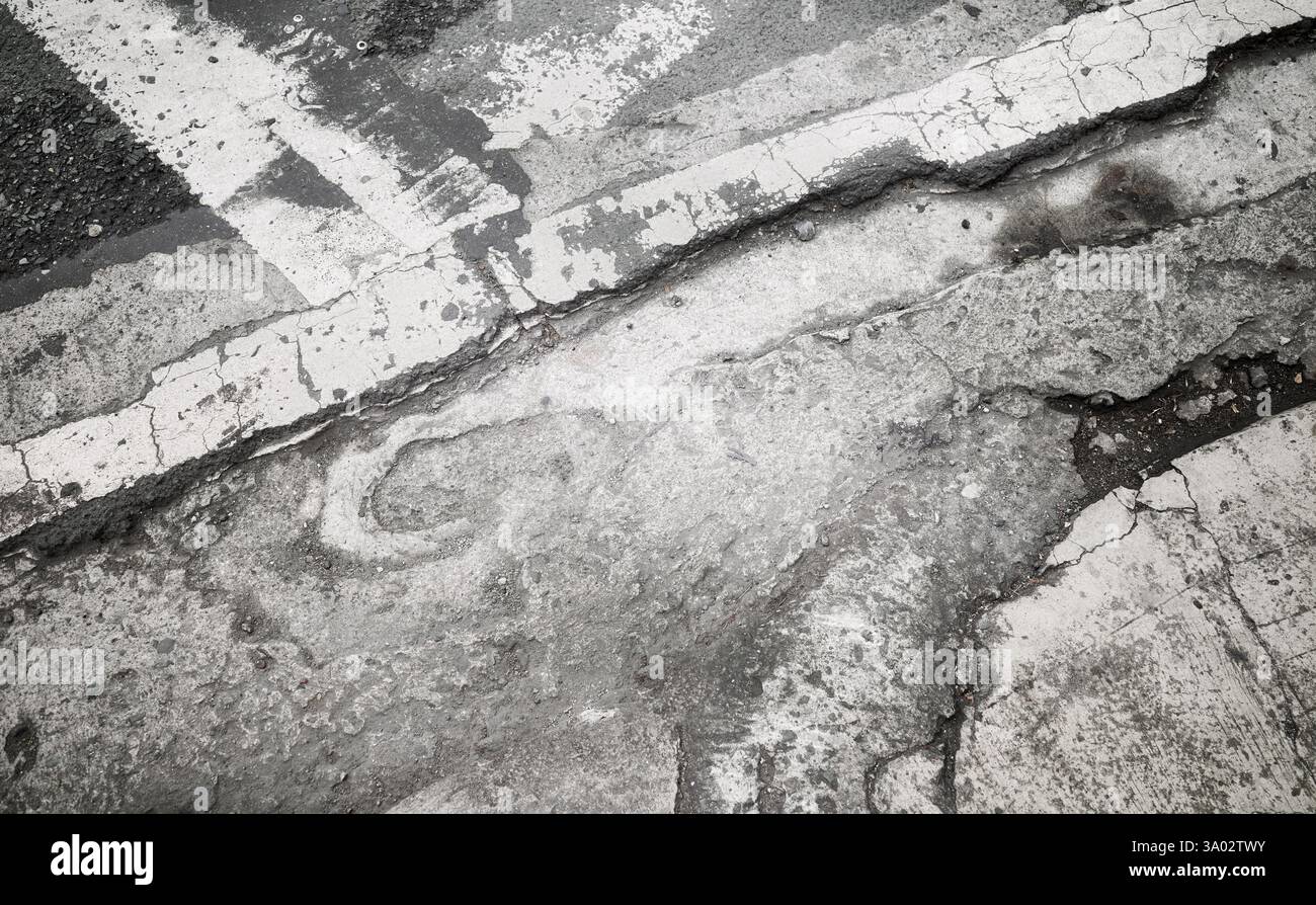 Grunge cracked asphalt background or texture. Stock Photo