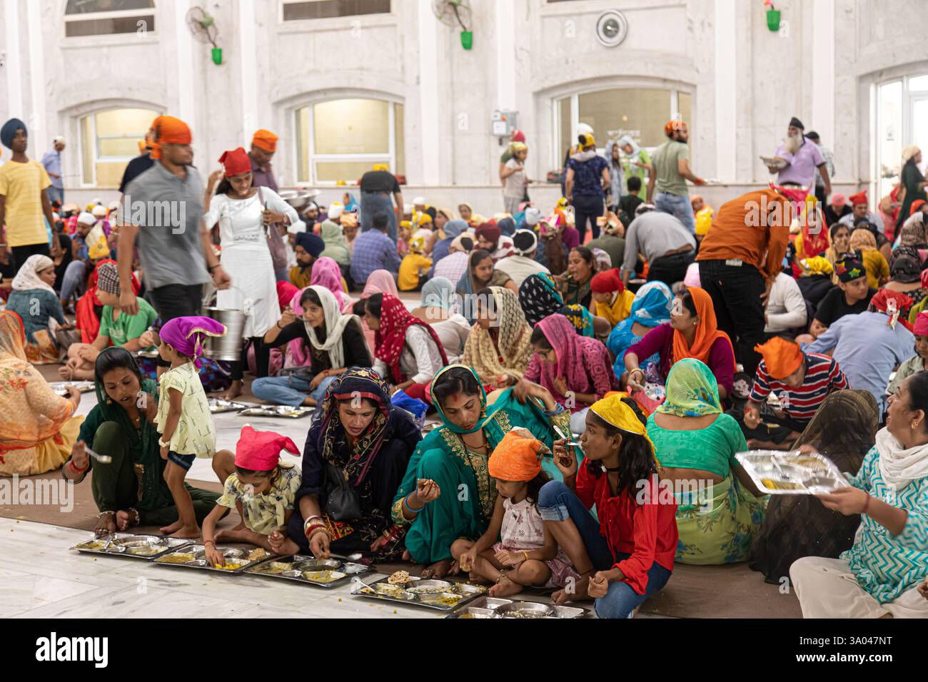 Delhi, India - 8-16-2022: pilgrims and tourists in Gurudwara Bangla ...