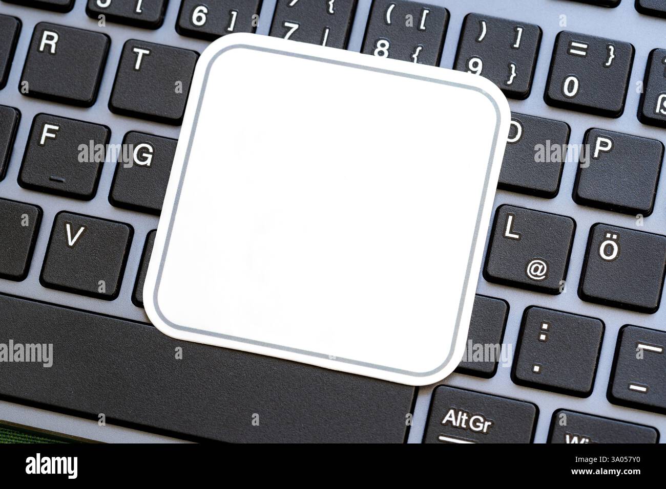 Full simple blank white square label on a laptop computer keyboard ...