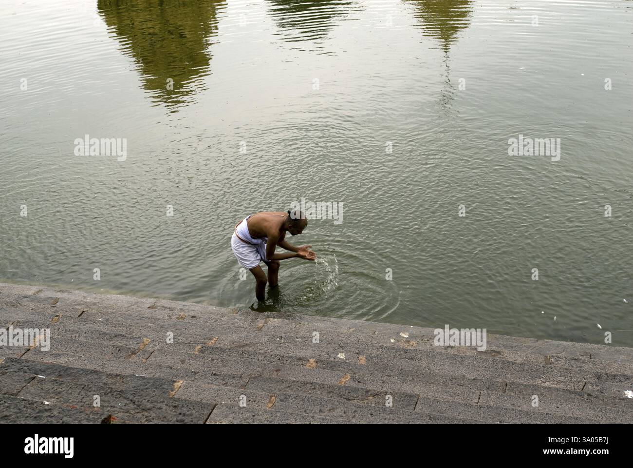 Priest performing daily rituals at Varadaraja Perumal temple in ...