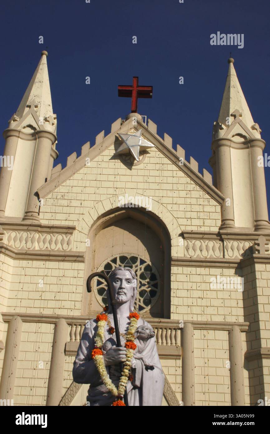 St. Patrick cathedral with red cross and star on top and statue of ...