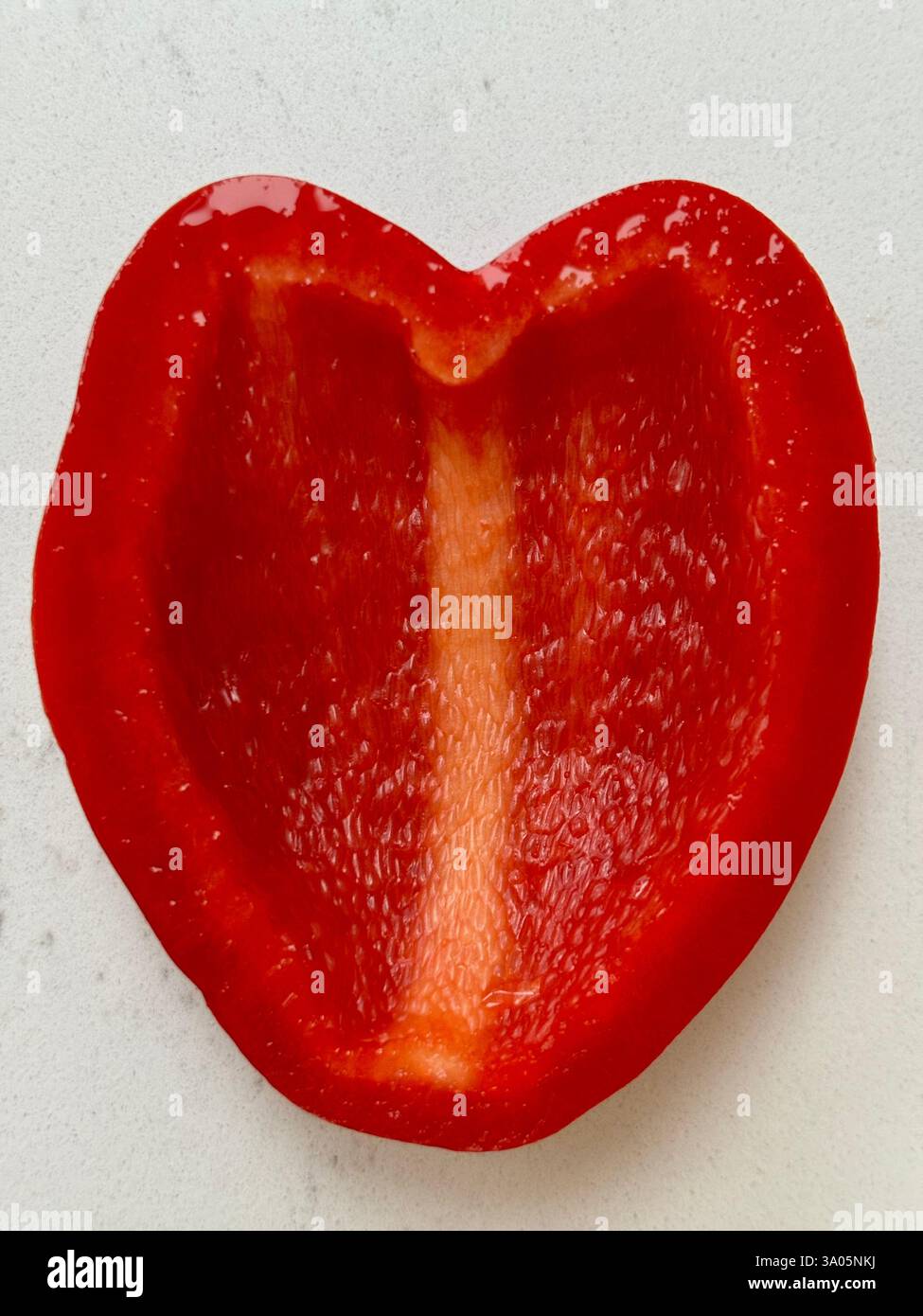 Red bell Pepper cut into Heart Shape - Smartphone Captured Stock Image