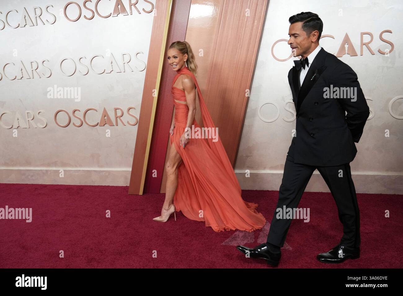 Kelly Ripa, left, and Mark Consuelos arrive at the Oscars on Sunday