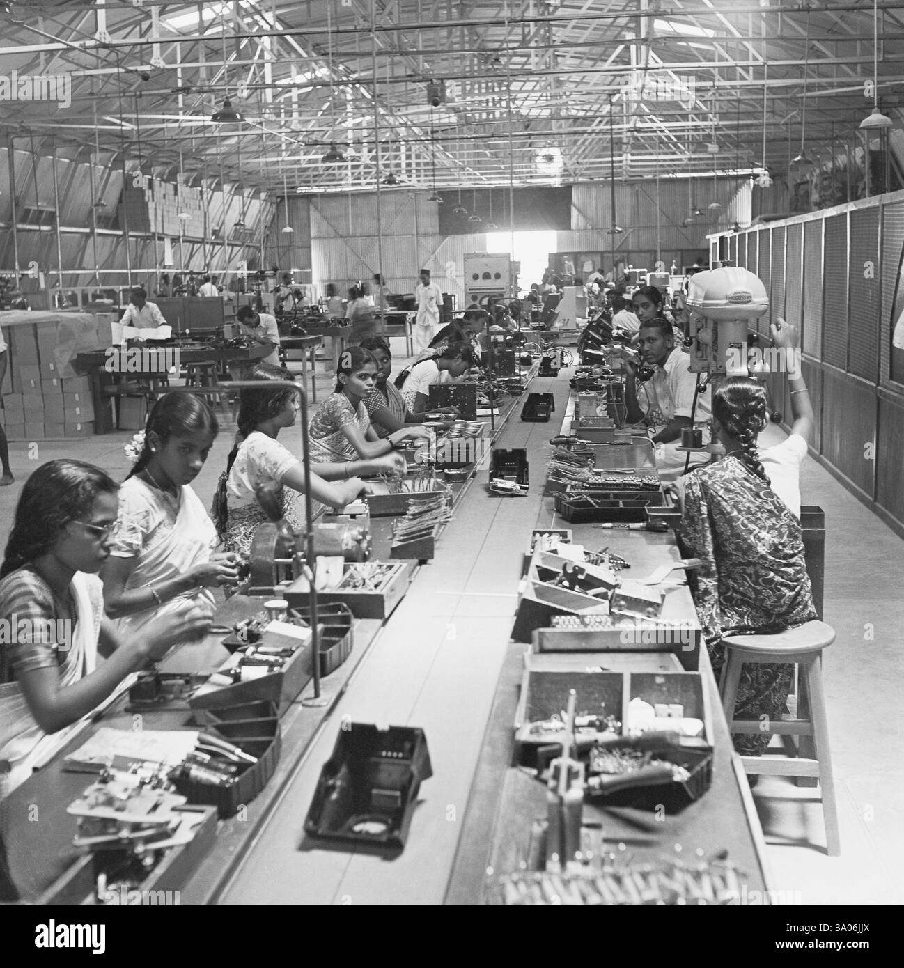 Workers at the assembly line, telephone factory, manufacturing of ...