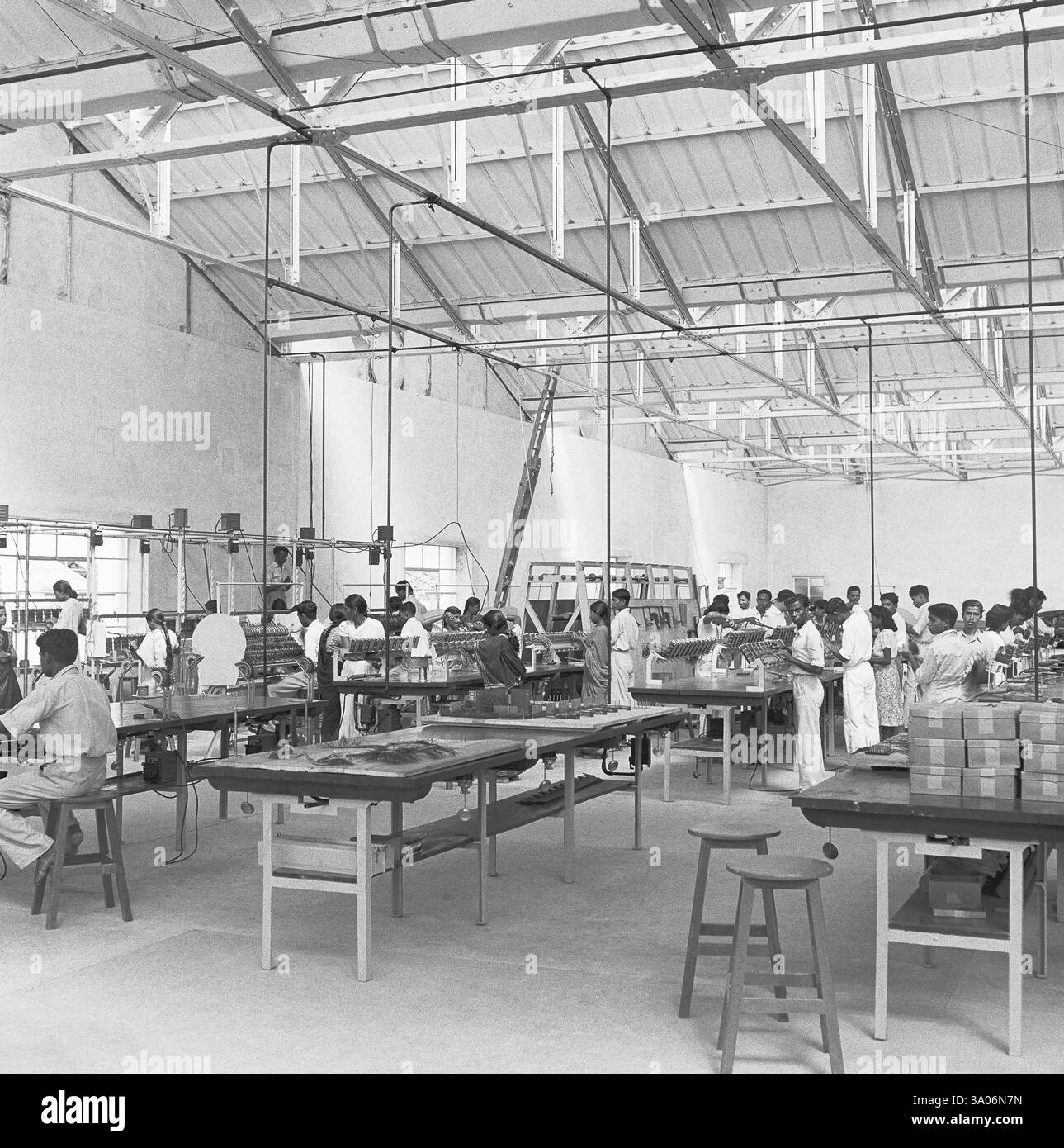 Workers at the assembly line, telephone factory, manufacturing of ...