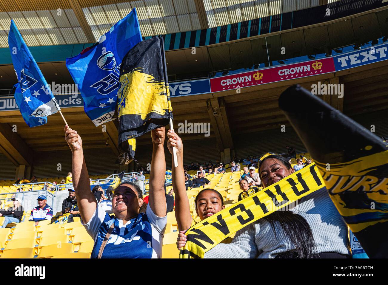 WELLINGTON, NEW ZEALAND - March 01: Hurricanes and Blues fans pose for ...