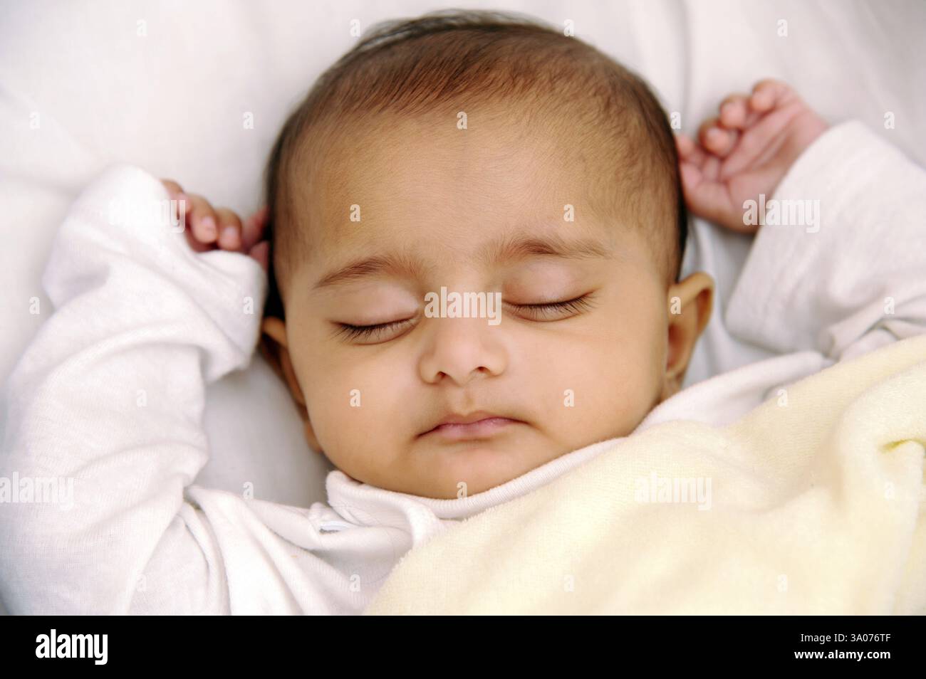Indian baby sleeping on bed hi-res stock photography and images - Alamy