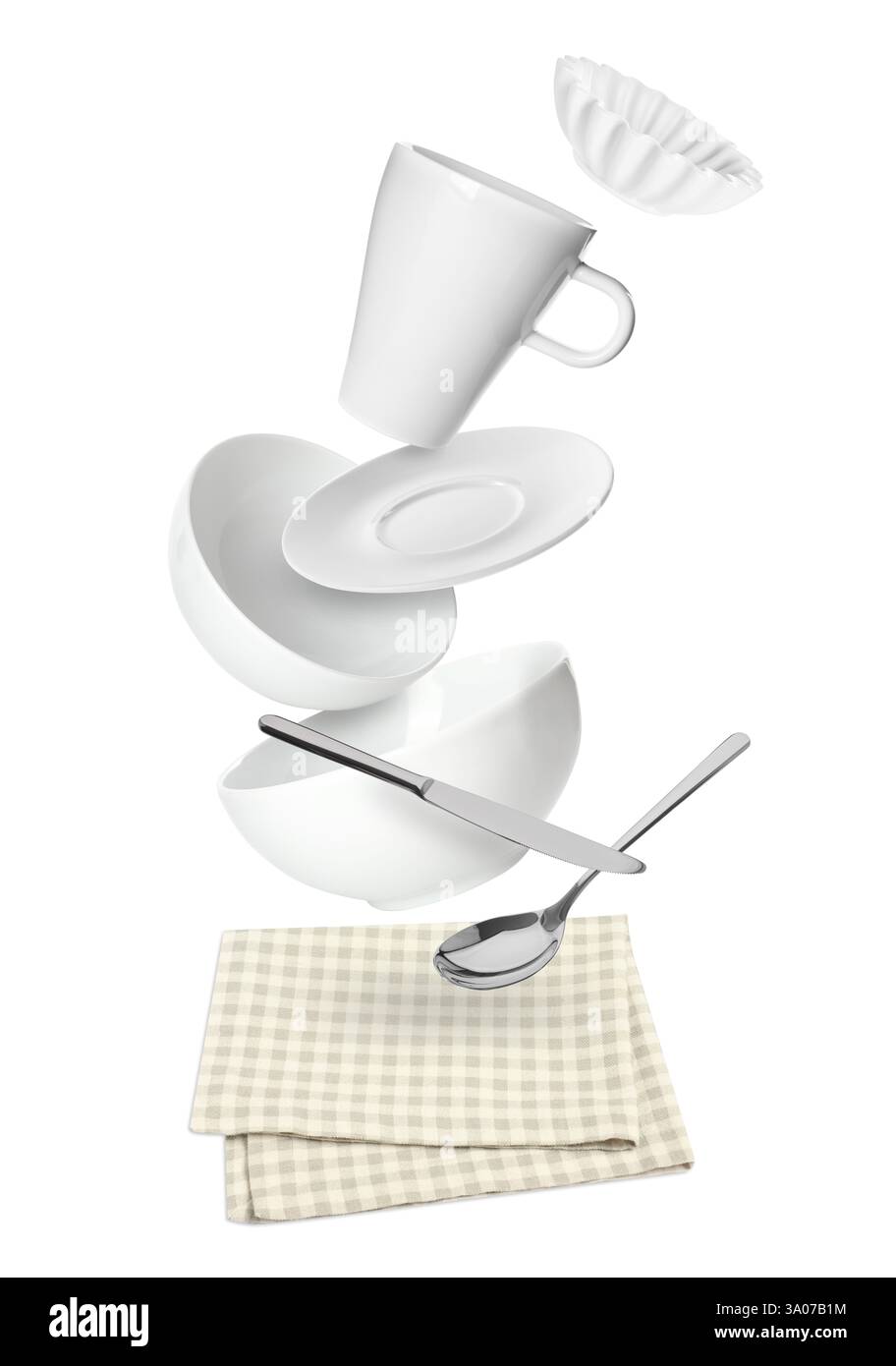 Clean dishware and silverware flying over napkin on white background Stock Photo